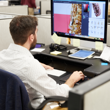 A man sitting at a desk and working